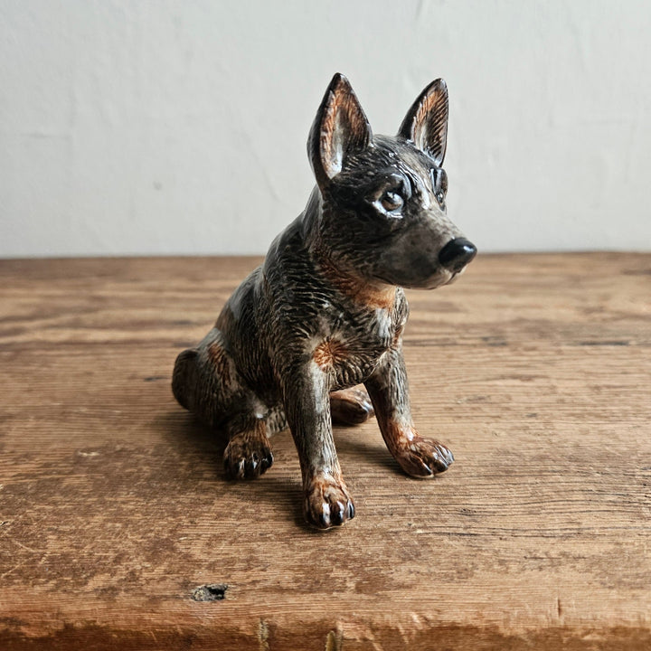 Ceramic sitting brown dog